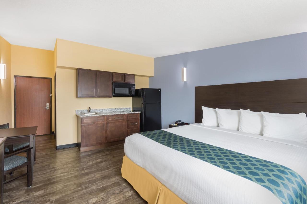 Queen Room with Two Queen Beds and Kitchenette - Non-Smoking at Days Inn by Wyndham New Orleans Pontchartrain