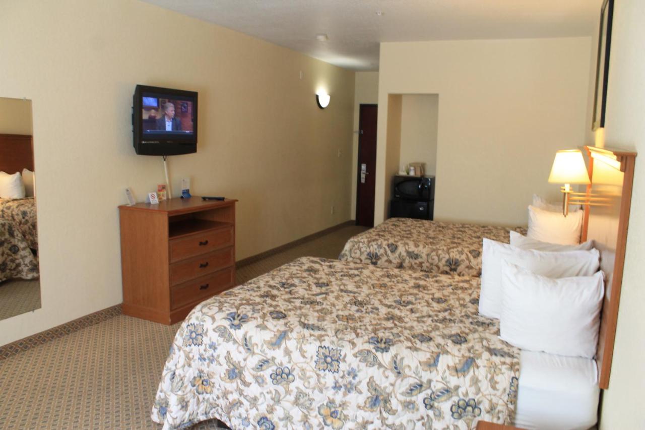 Queen Room with Two Queen Beds - Non-Smoking at Days Inn by Wyndham San Antonio at Palo Alto