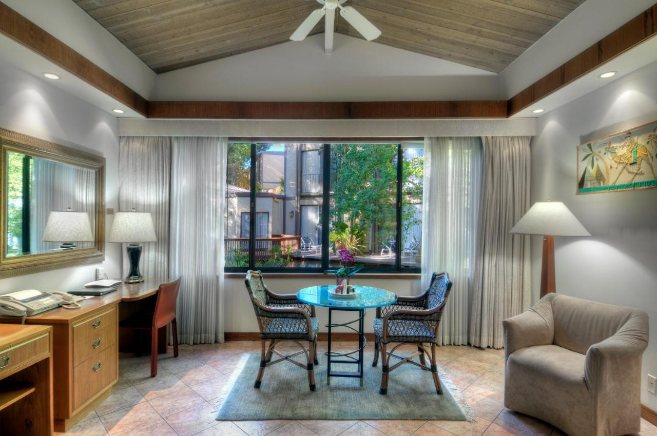 King Suite with Fireplace at Dinah's Garden Hotel