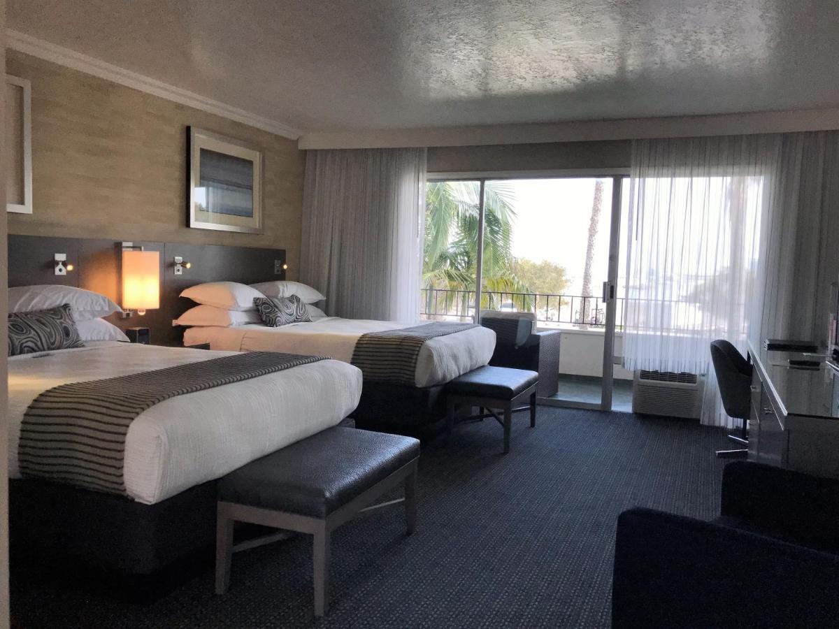 Queen Room with Two Queen Beds and Harbor View at West Beach Inn, a Coast Hotel