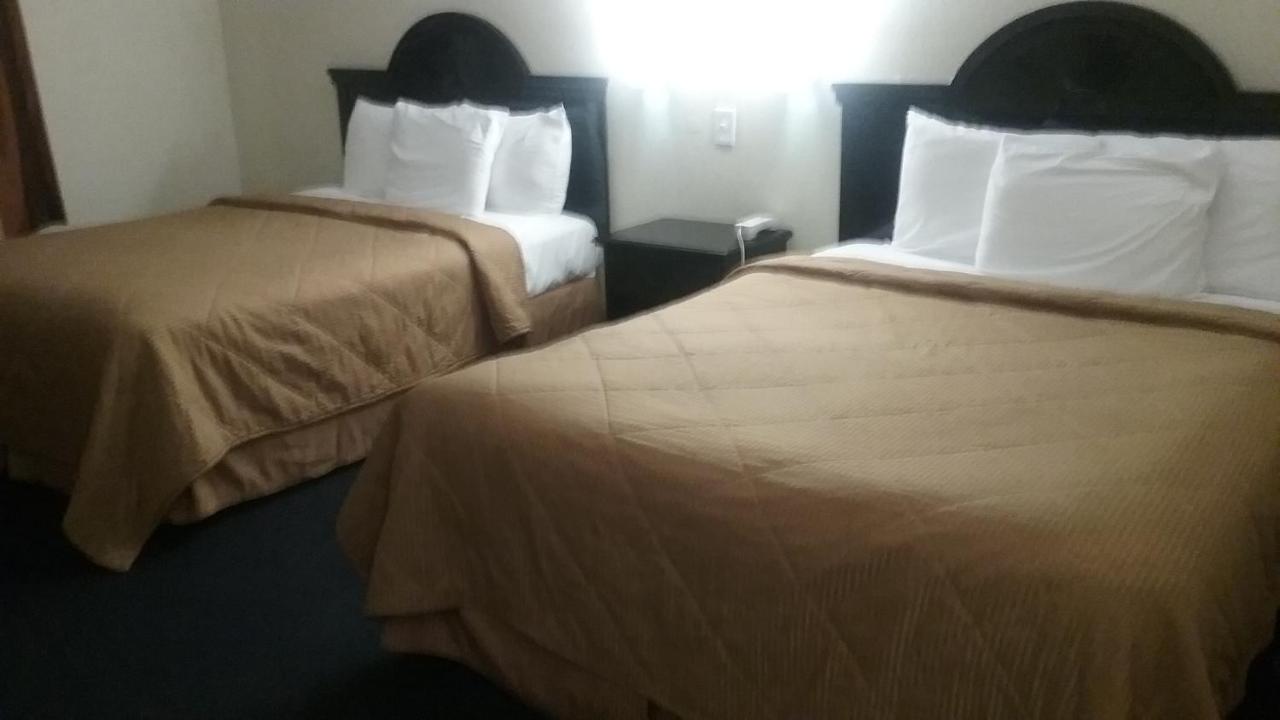 Queen Room with Two Queen Beds at Noble Suites