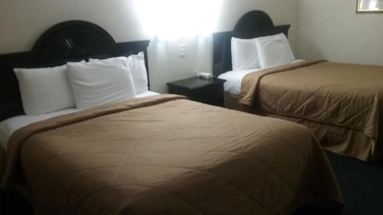Queen Room with Two Queen Beds at Noble Suites