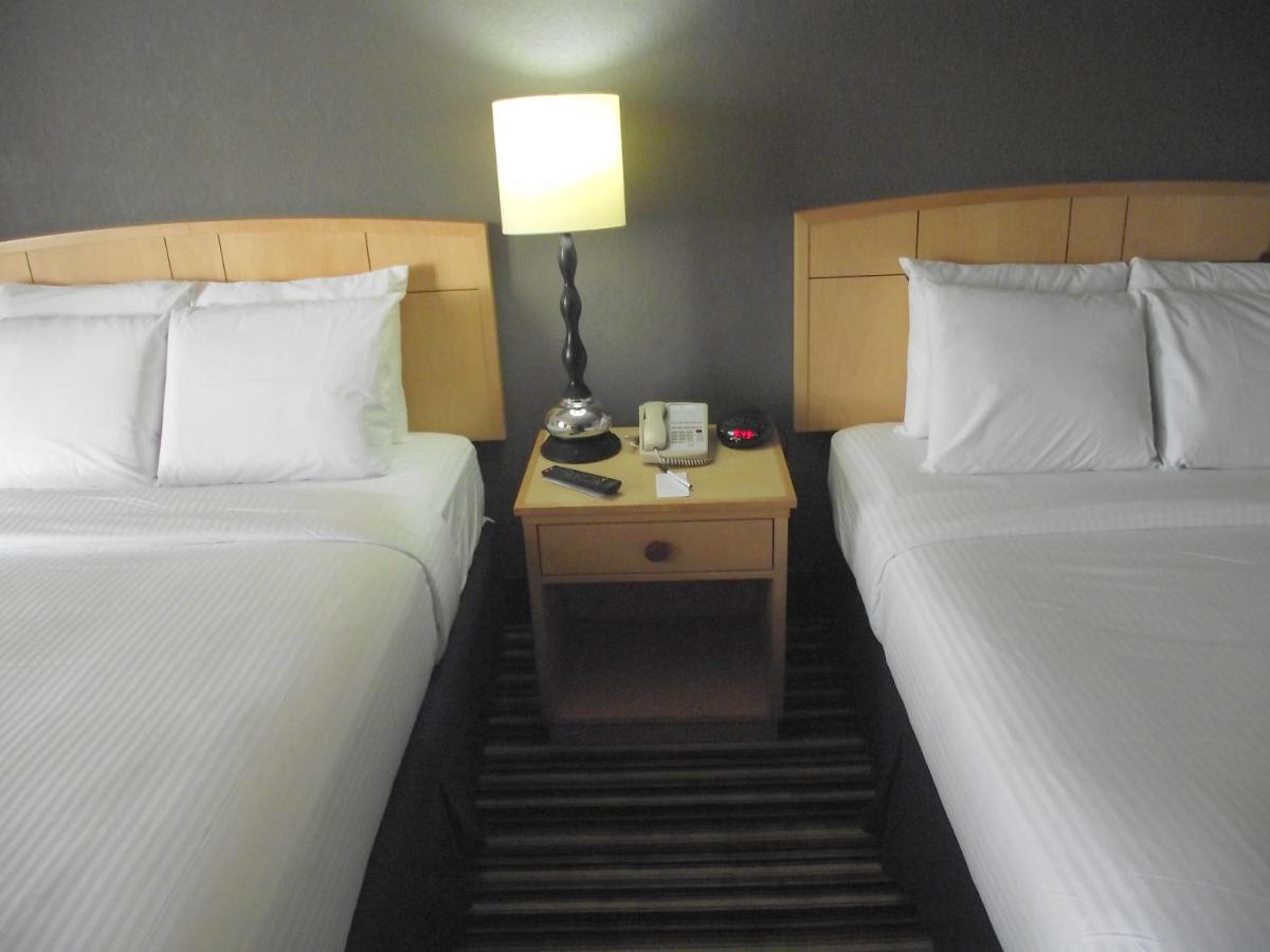 Deluxe Queen Room with Two Queen Beds - Non-Smoking at Travelodge by Wyndham Memphis Airport/Graceland