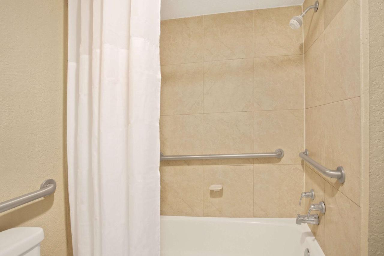 Queen Room with Two Queen Beds - Non-Smoking at Days Inn by Wyndham Orlando Airport Florida Mall