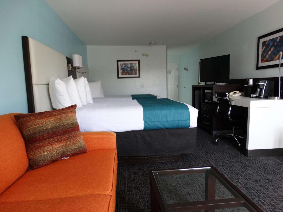 Queen Room with Two Queen Beds and Sofa Bed at Best Western Plus Orlando Lake Buena Vista South Inn & Suites