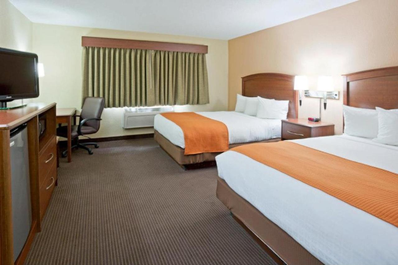 Queen Room with Two Queen Beds - Non-Smoking at AmericInn by Wyndham Fargo West Acres
