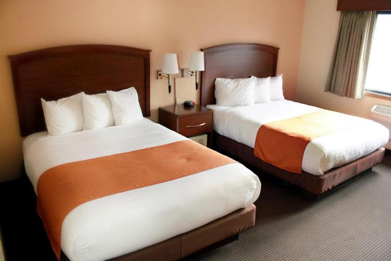Queen Room with Two Queen Beds - Non-Smoking at AmericInn by Wyndham Fargo West Acres