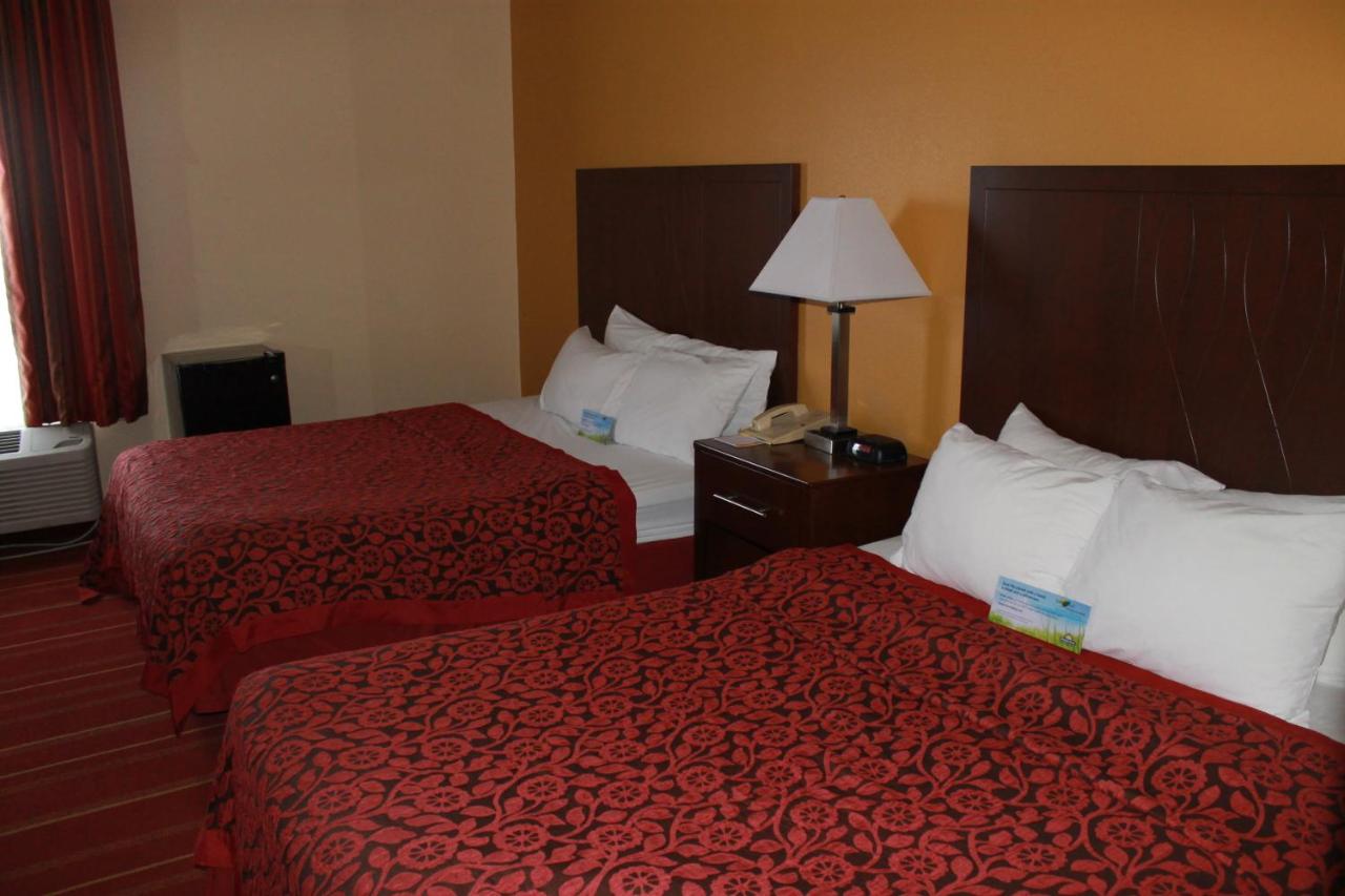 Queen Room with Two Queen Beds - Smoking at Days Inn by Wyndham Walcott Davenport