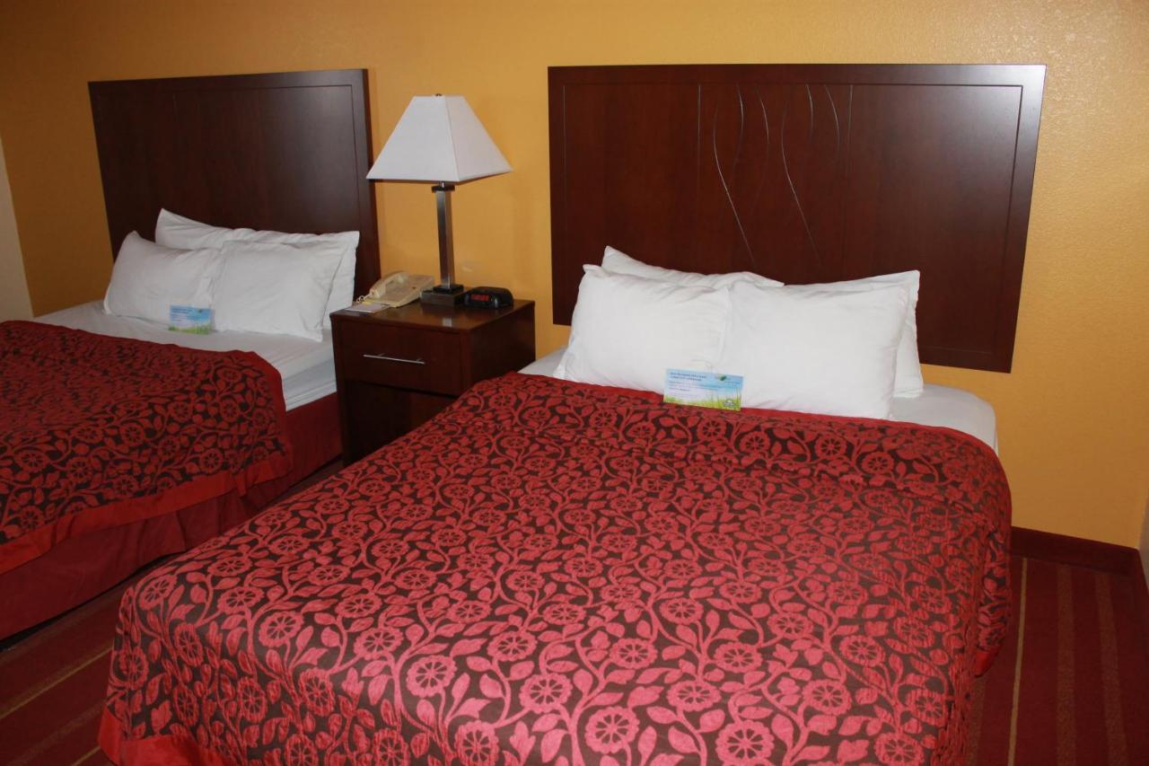 Queen Room with Two Queen Beds - Smoking at Days Inn by Wyndham Walcott Davenport
