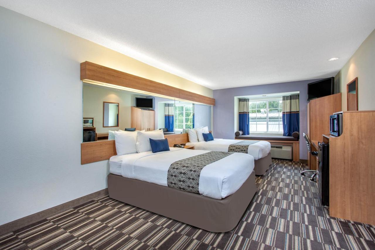 Deluxe Queen Room with Two Queen Beds - Non-Smoking at Microtel Inn & Suites by Wyndham Lillington / Campbell Univ