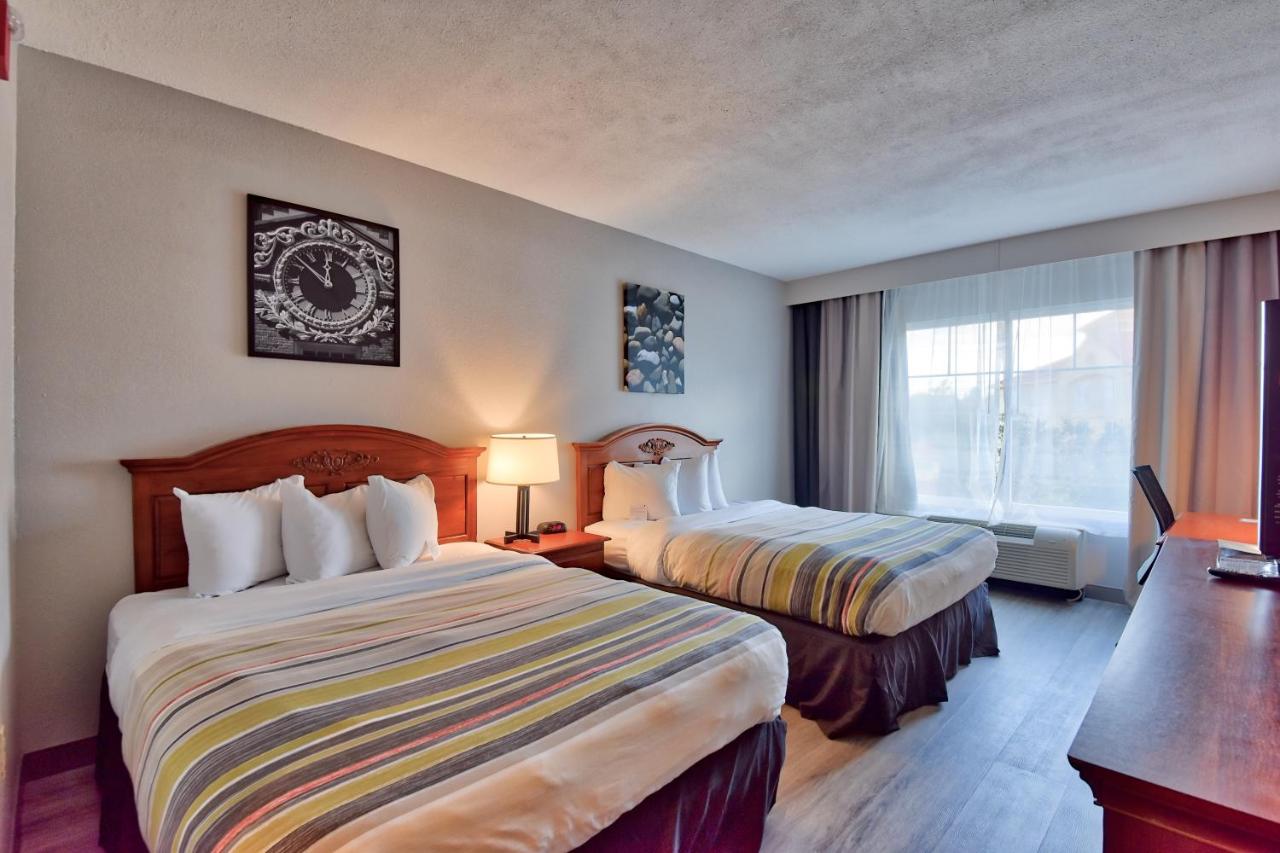 Queen Room with Two Queen Beds - Non-Smoking at Country Inn & Suites by Radisson, Ocala Southwest