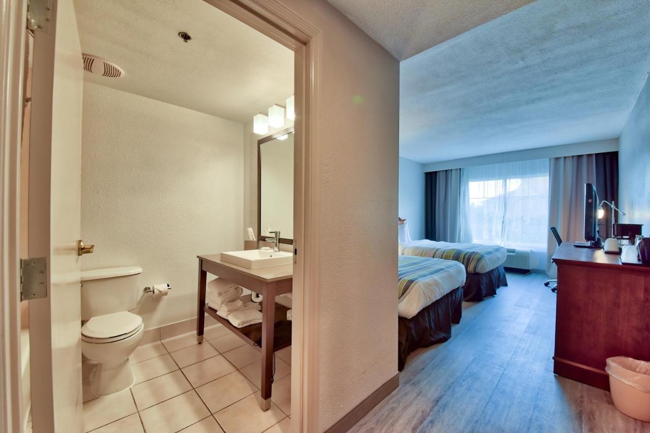 Queen Room with Two Queen Beds - Non-Smoking at Country Inn & Suites by Radisson, Ocala Southwest