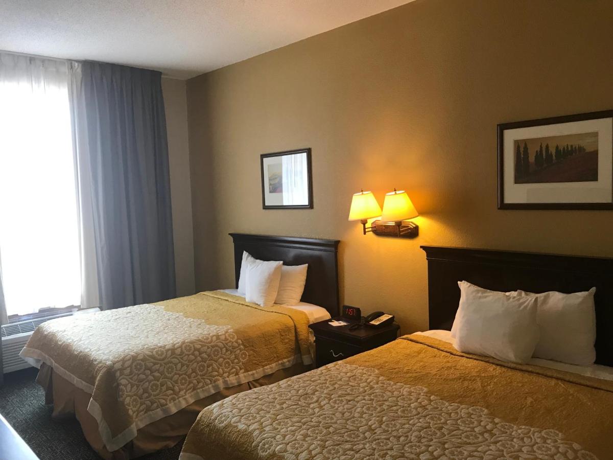 Deluxe Queen Room with Two Queen Beds - Non-Smoking at Days Inn & Suites by Wyndham Tucker/Northlake