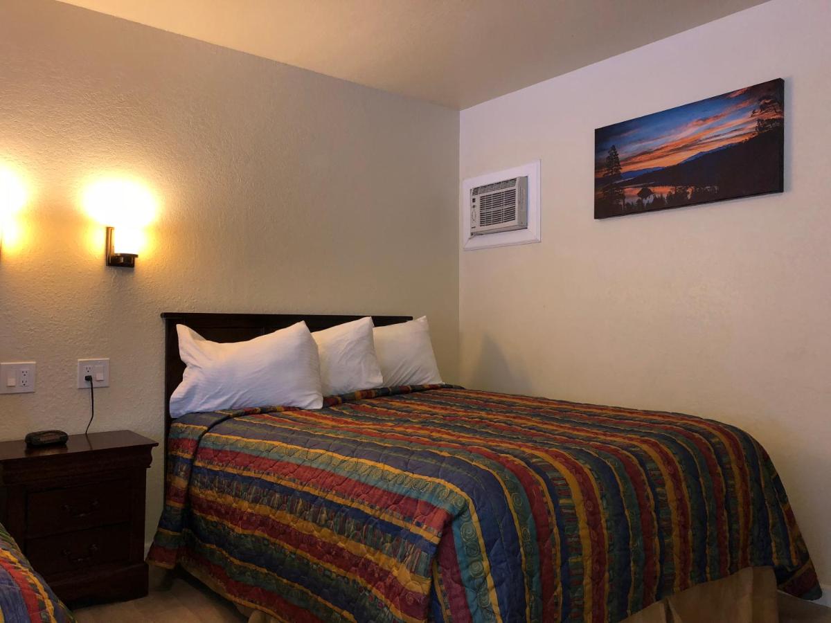 Queen Room with Two Queen Beds at Cedar Inn & Suites