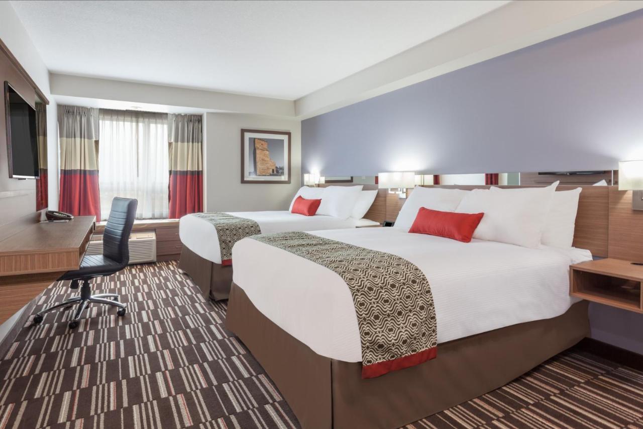 Queen Room with Two Queen Beds and Roll-In Shower - Mobility/Hearing Accessible - Non-Smoking at Microtel Inn & Suites by Wyndham College Station