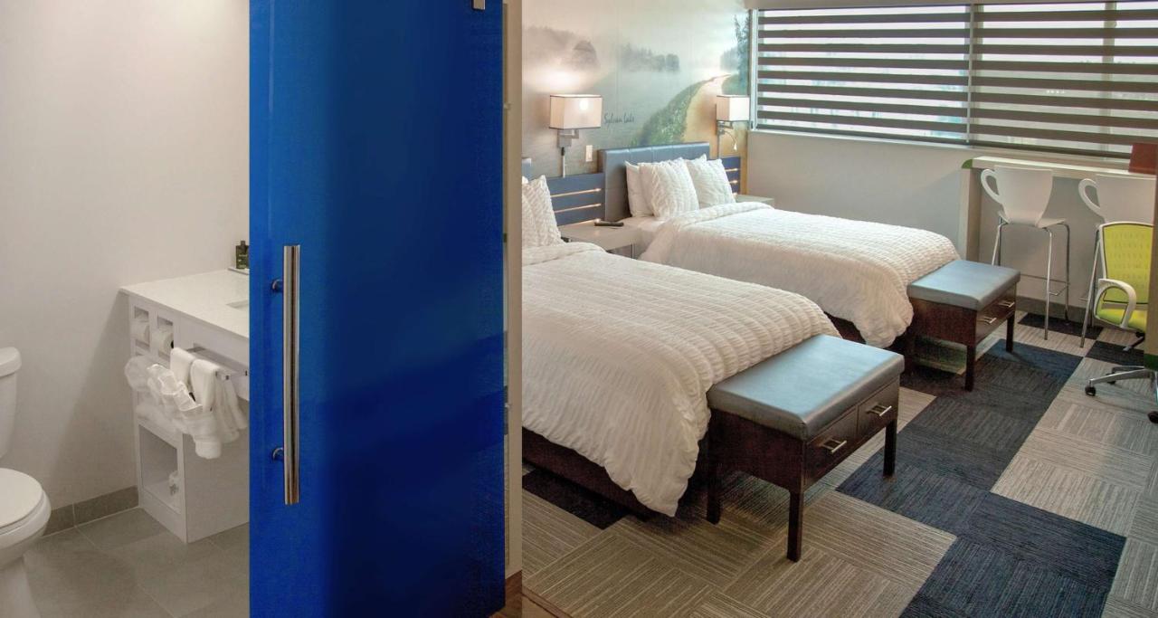 Queen Room with Two Queen Beds and City View at The Rushmore Hotel & Suites, BW Premier Collection