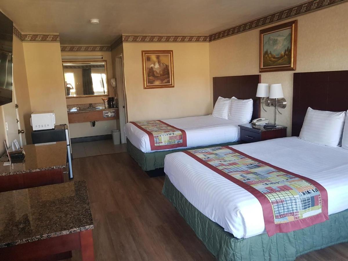 Queen Room with Two Queen Beds - Non-Smoking at Travelodge by Wyndham Costa Mesa Newport Beach Hacienda