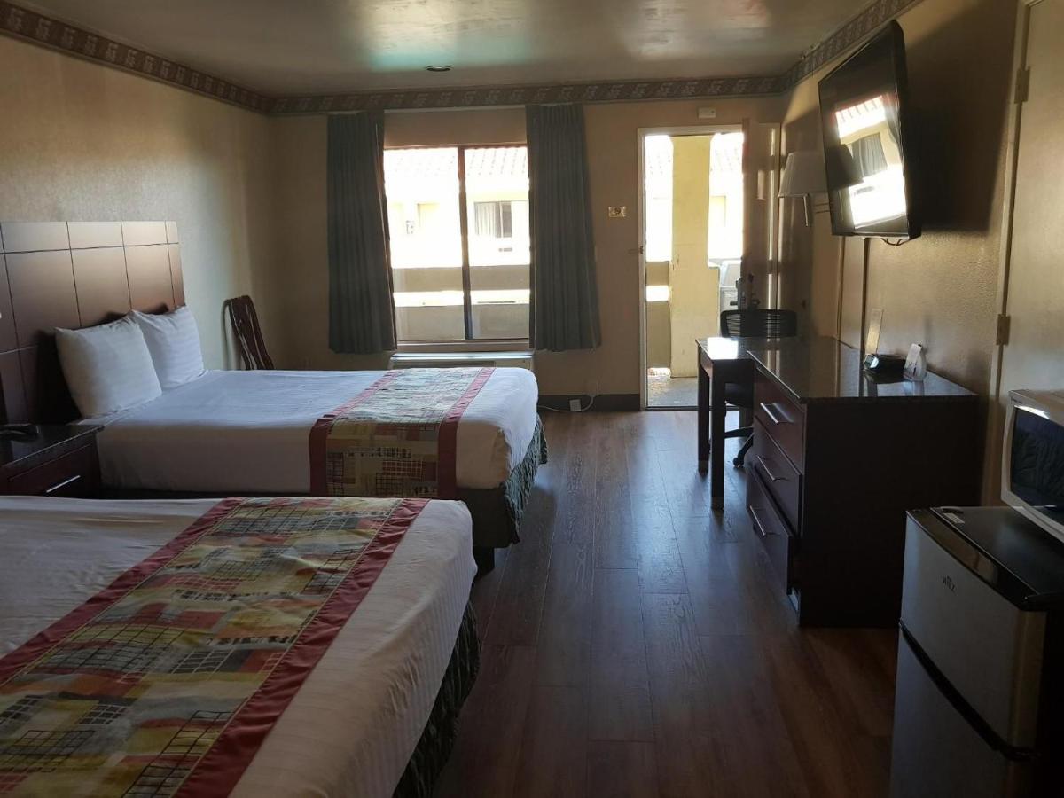 Queen Room with Two Queen Beds - Non-Smoking at Travelodge by Wyndham Costa Mesa Newport Beach Hacienda