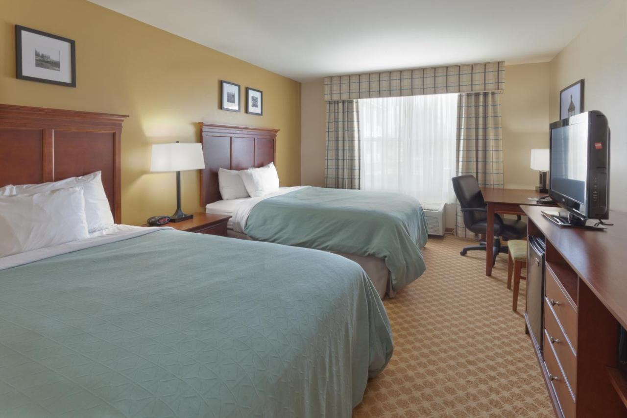 Queen Room with Two Queen Beds at Country Inn & Suites by Radisson, Holland, MI