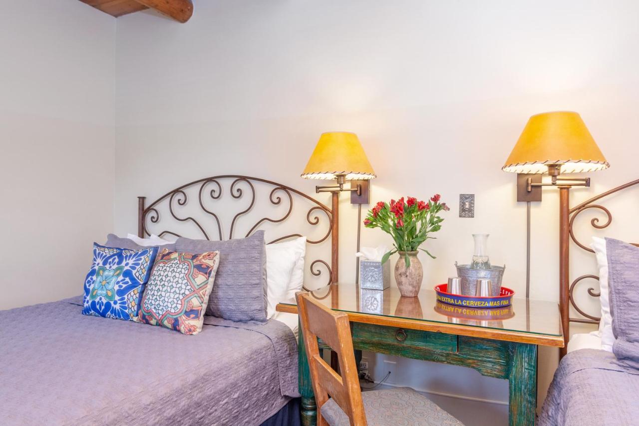 Queen Room with Two Queen Beds with Patio - Pet-Friendly at Santa Fe Motel & Inn