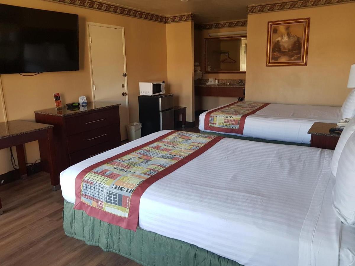 Queen Room with Two Queen Beds - Non-Smoking at Travelodge by Wyndham Costa Mesa Newport Beach Hacienda