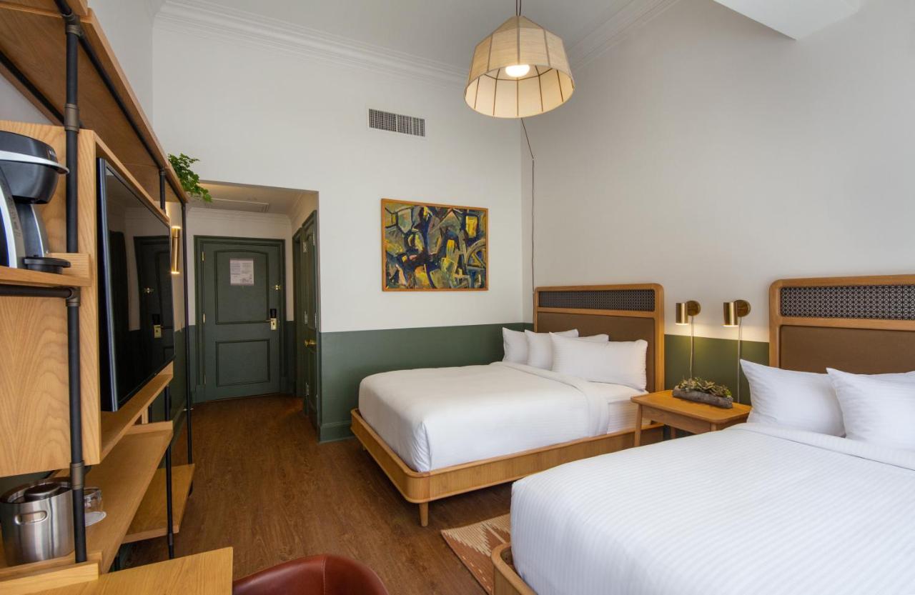 Standard Queen Room with Two Queen Beds at Hotel Theo New Orleans, Tapestry Collection by Hilton