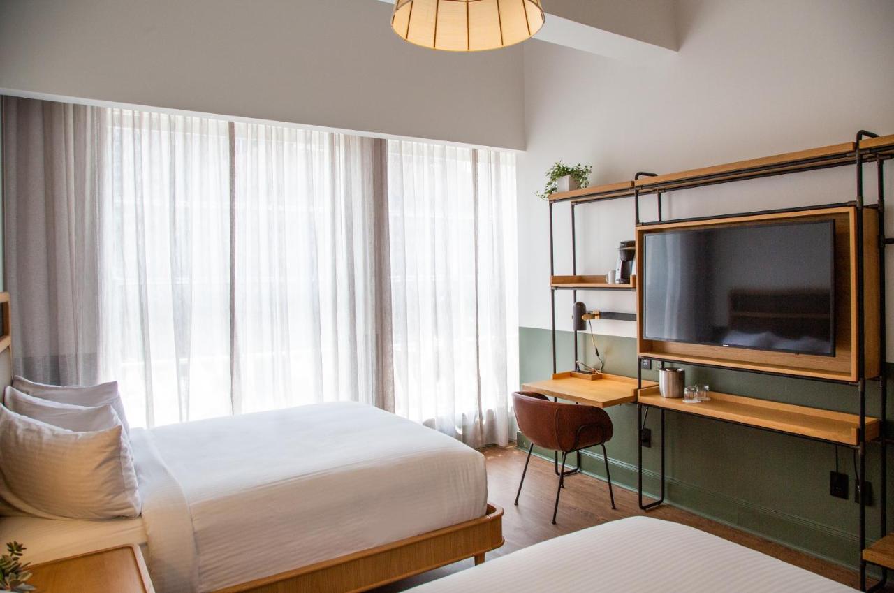 Standard Queen Room with Two Queen Beds at Hotel Theo New Orleans, Tapestry Collection by Hilton