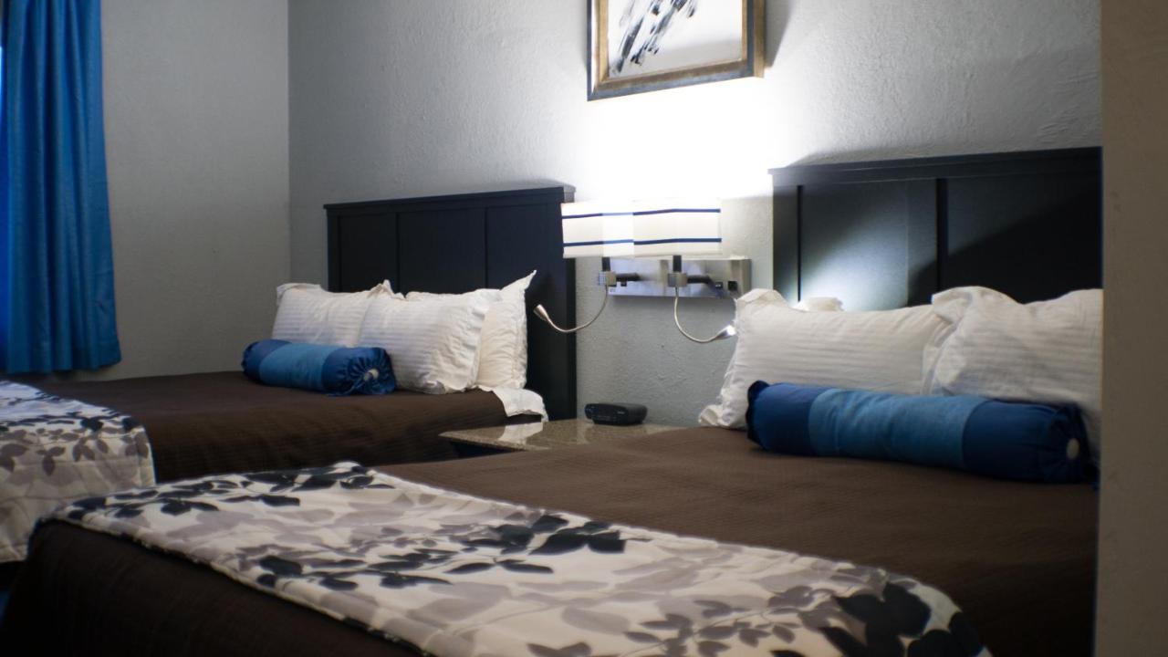 Queen Room with Two Queen Beds - Interior Corridor at Rodeway Inn & Suites Nampa