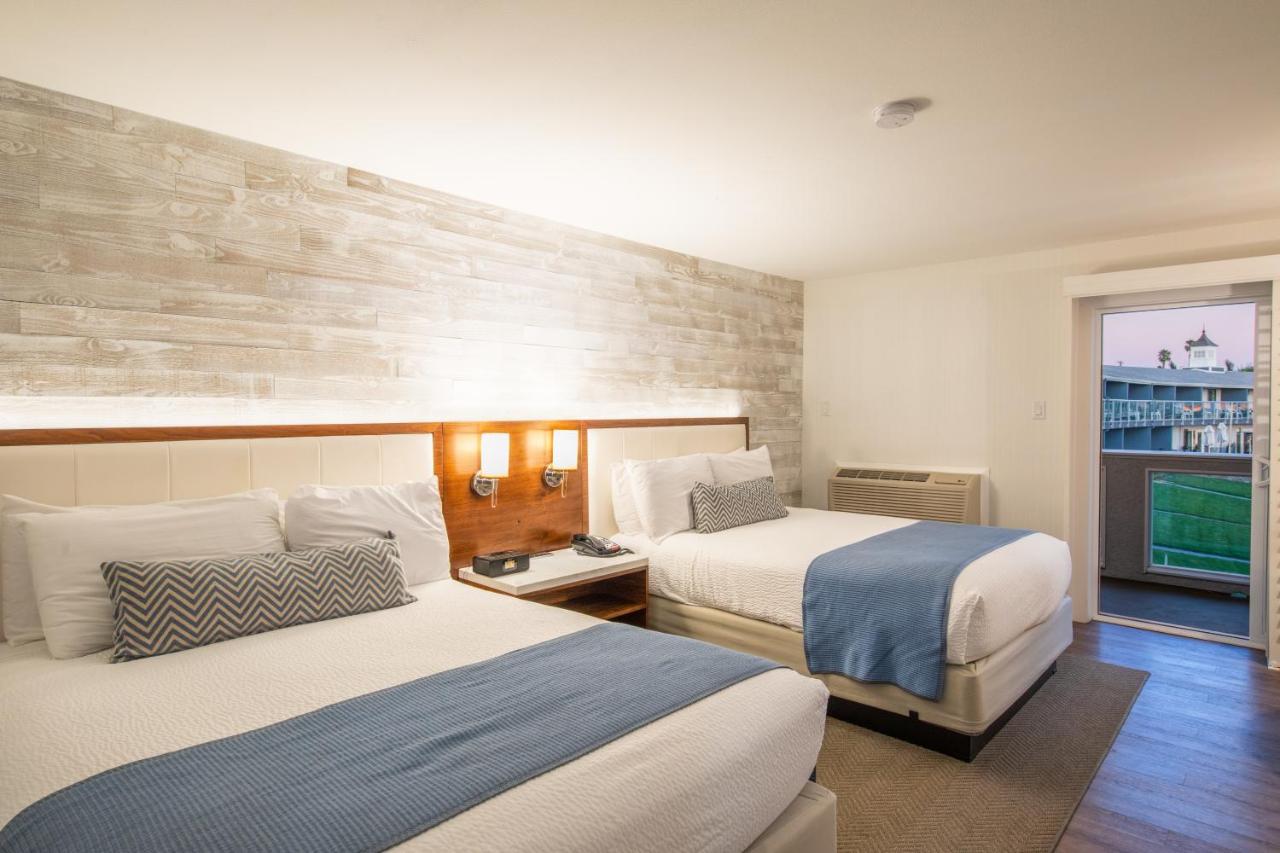 Queen Room with Two Queen Beds and Partial Ocean View at SeaCrest OceanFront Hotel