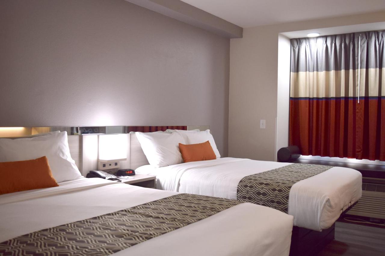 Queen Room with Two Queen Beds - Non-Smoking at Microtel Inn & Suites by Wyndham Raleigh