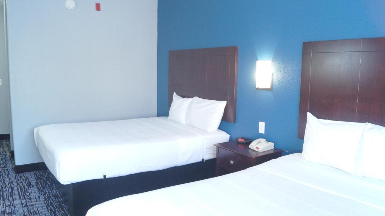 Queen Room with Two Queen Beds at Magnolia Inn and Suites Olive Branch
