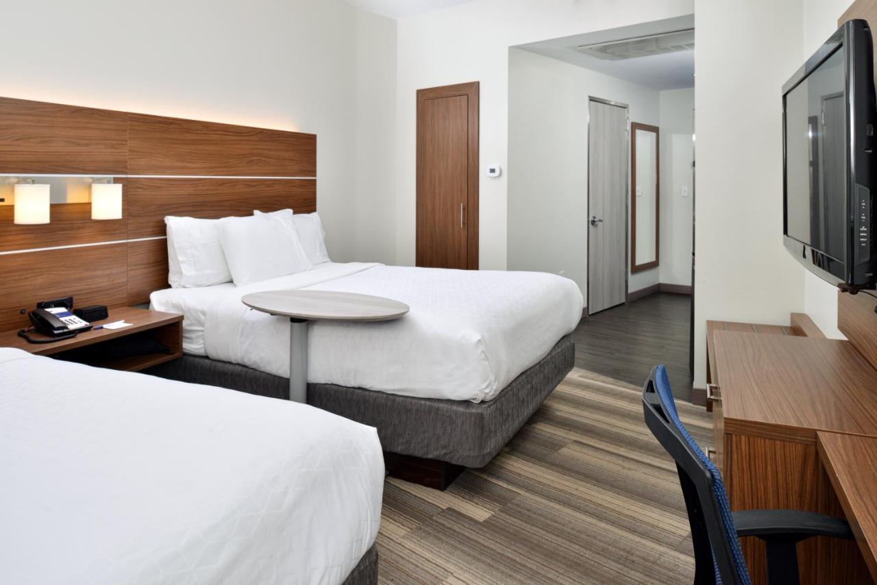 Queen Room with Two Queen Beds - Non-Smoking at Holiday Inn Express New Orleans - Arts District by IHG