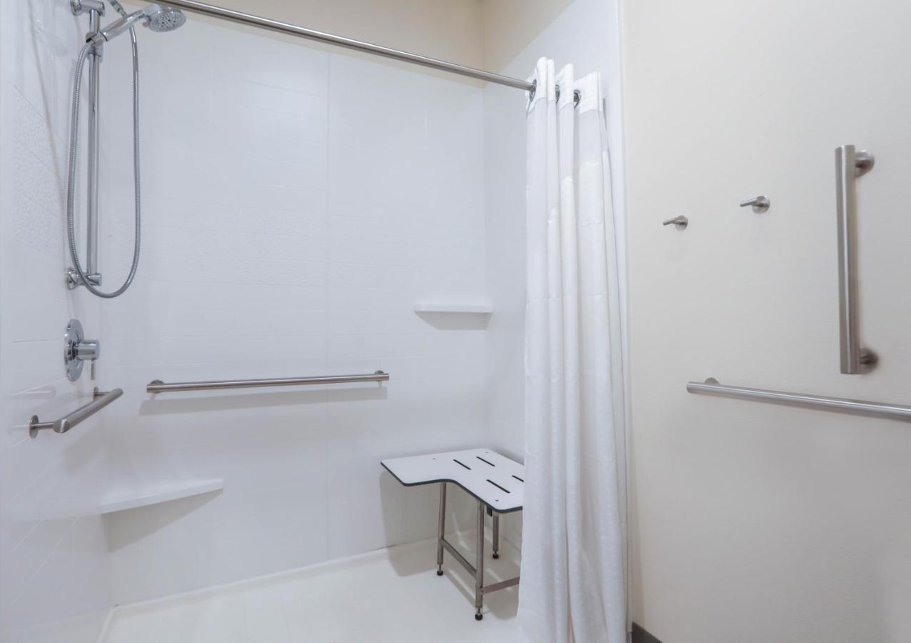 King Room with Accessible Roll-In Shower and Balcony at Holiday Inn & Suites Sioux Falls - Airport, an IHG Hotel