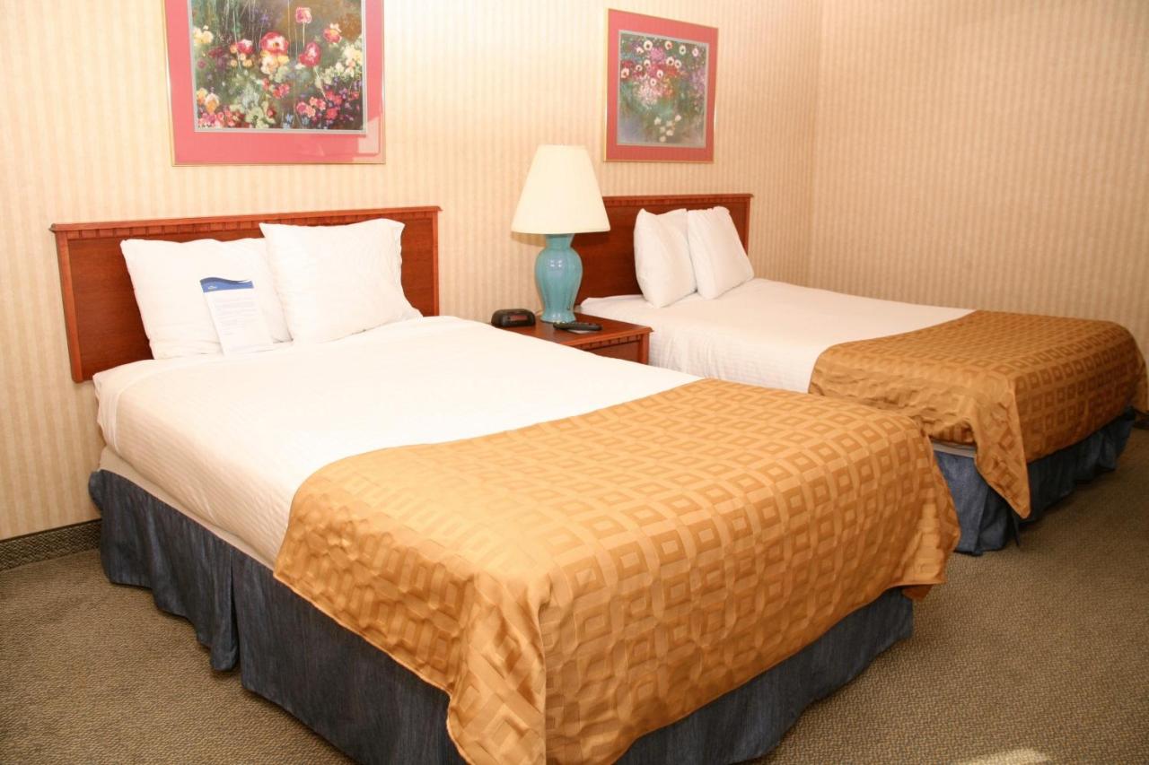 Queen Room with Two Queen Beds - Non-Smoking at Baymont by Wyndham Detroit/Roseville
