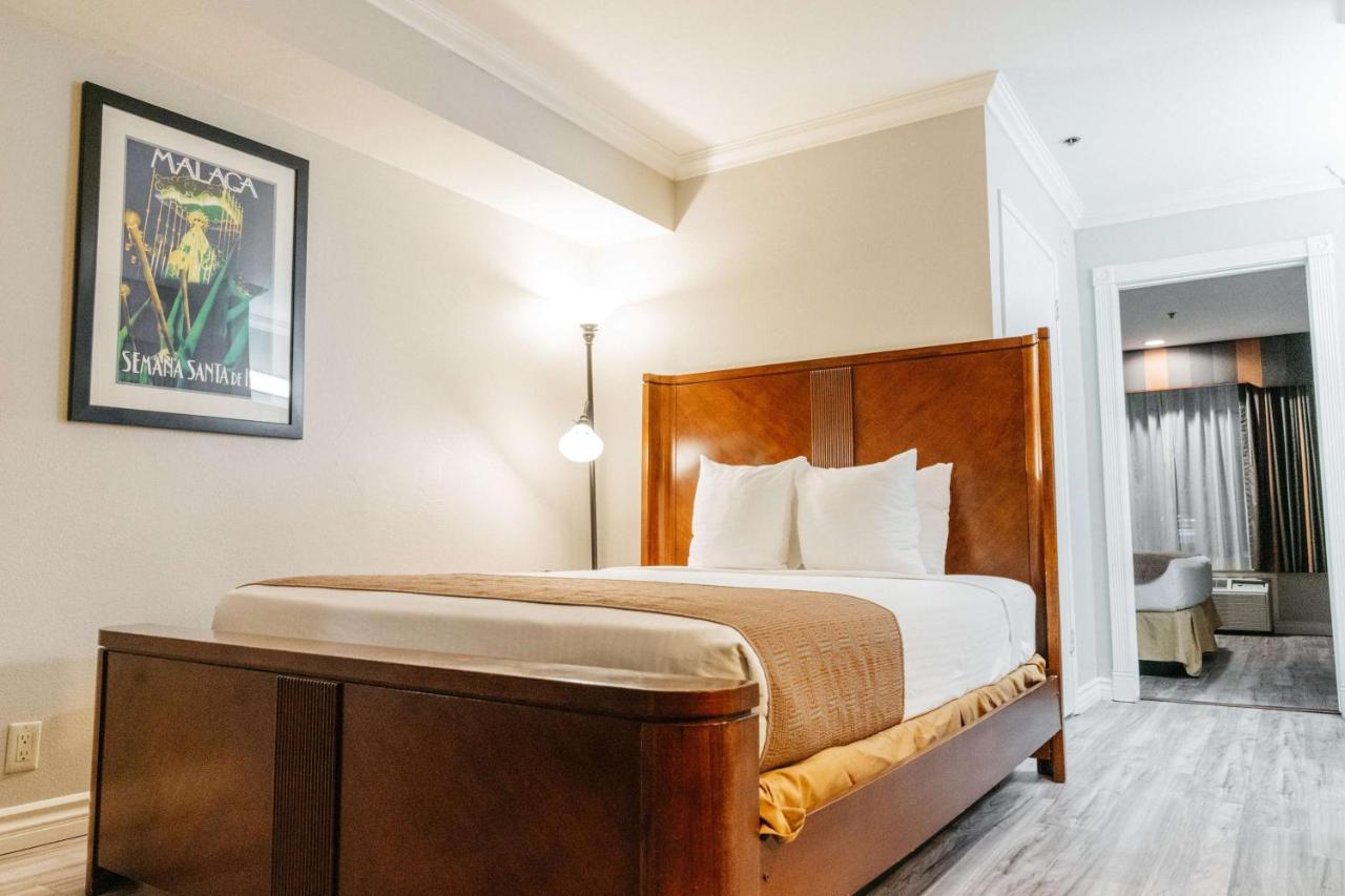 Suite with One King and One Queen Bed at Best Western Palm Garden Inn