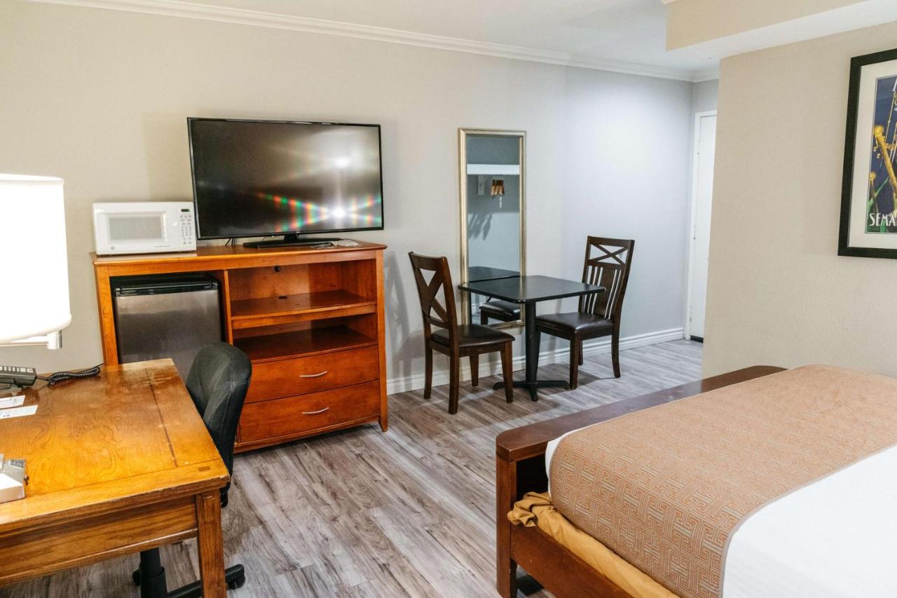 Suite with One King and One Queen Bed at Best Western Palm Garden Inn