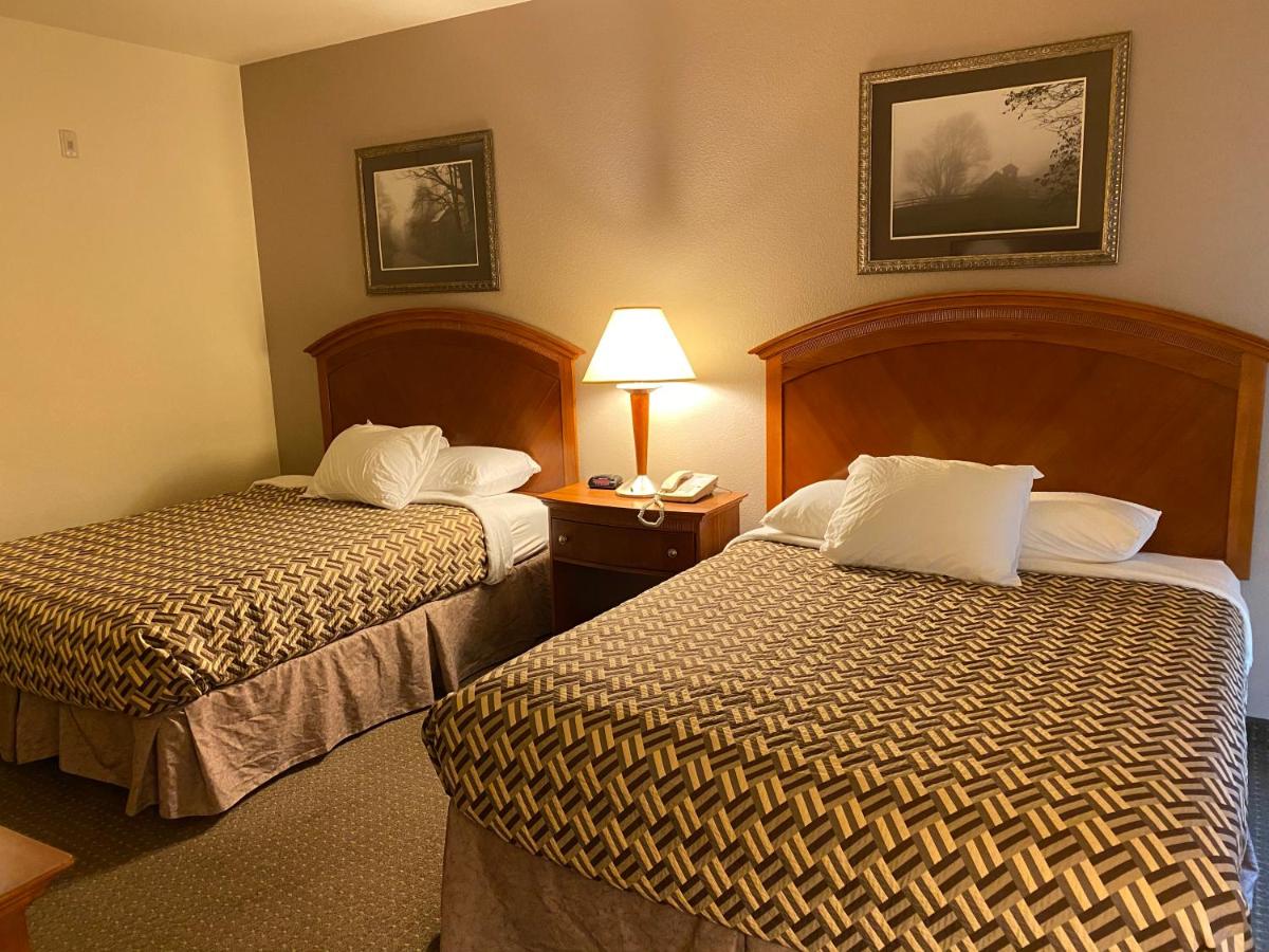 Queen Room with Two Queen Beds - Non-Smoking at A Riverside Inn Travelodge by Wyndham