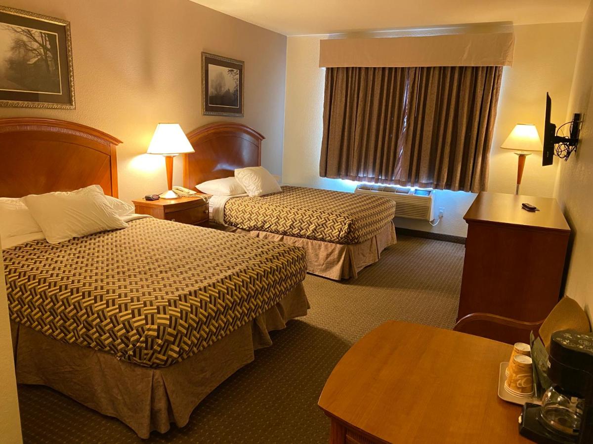 Queen Room with Two Queen Beds - Non-Smoking at A Riverside Inn Travelodge by Wyndham