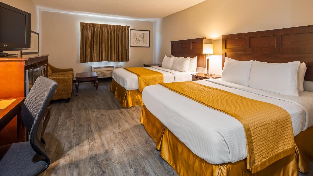 Queen Room with Two Queen Beds with Sofa Bed at SureStay Hotel by Best Western Orange