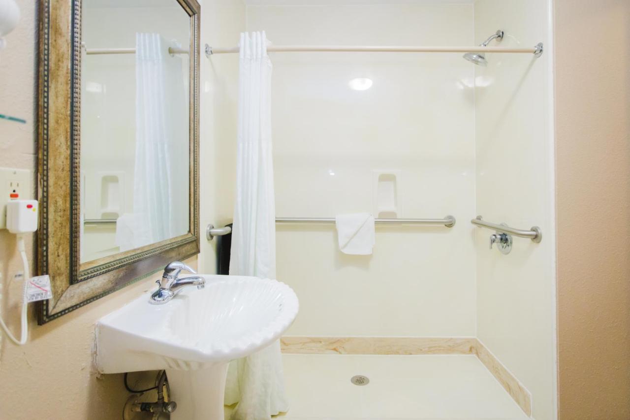 Queen Room with Two Queen Beds and Roll-In Shower - Mobility/Hearing Accessible - Non-Smoking at Days Inn by Wyndham Rosenberg