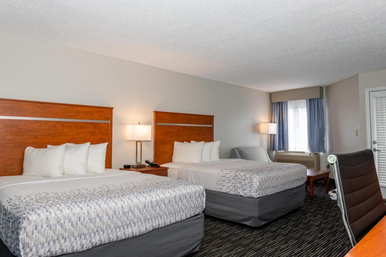 Queen Room with Two Queen Beds w/ fire place & private balcony at Twin Mountain Inn & Suites
