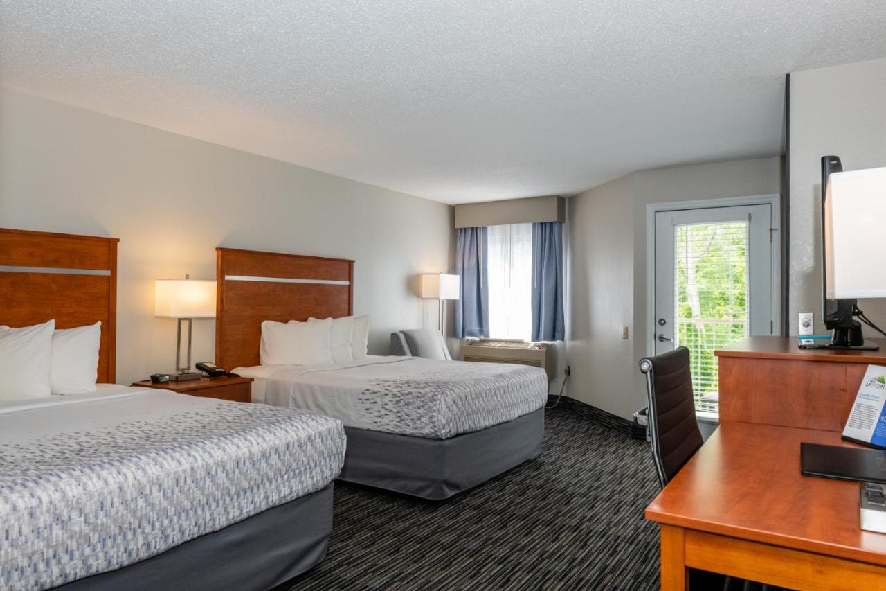 Queen Room with Two Queen Beds w/ fire place & private balcony at Twin Mountain Inn & Suites