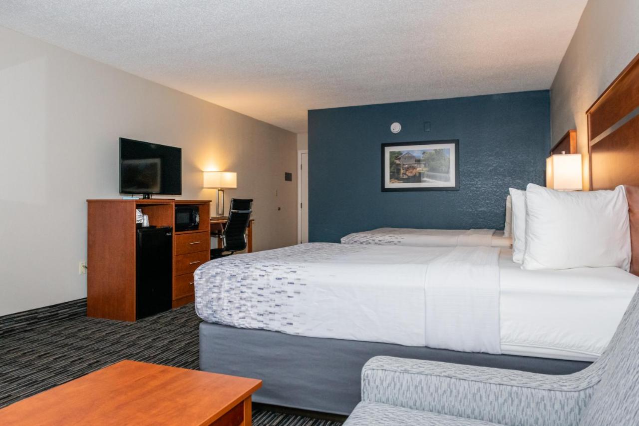 Queen Room with Two Queen Beds w/ fire place & private balcony at Twin Mountain Inn & Suites