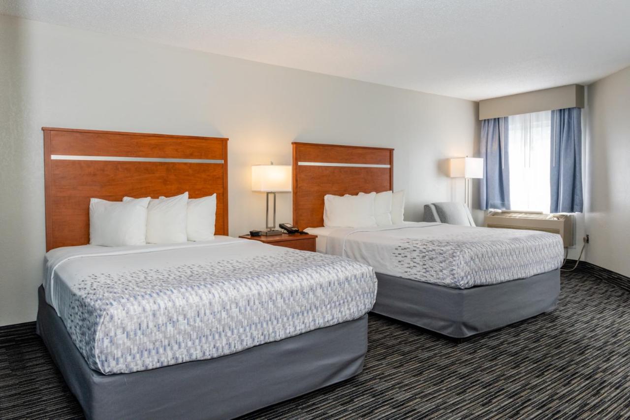 Queen Room with Two Queen Beds w/ fire place & private balcony at Twin Mountain Inn & Suites