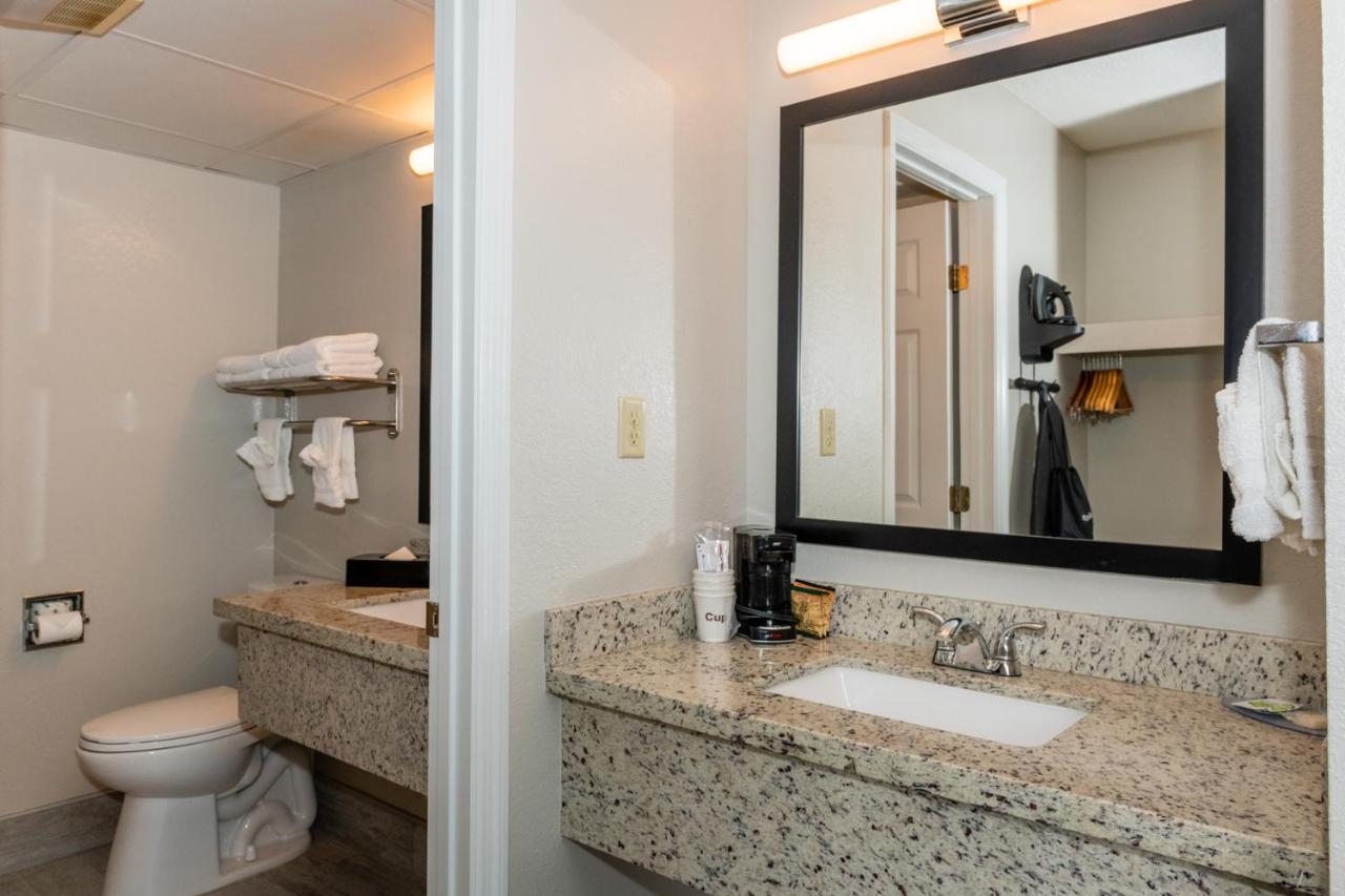 Queen Room with Two Queen Beds w/ fire place & private balcony at Twin Mountain Inn & Suites