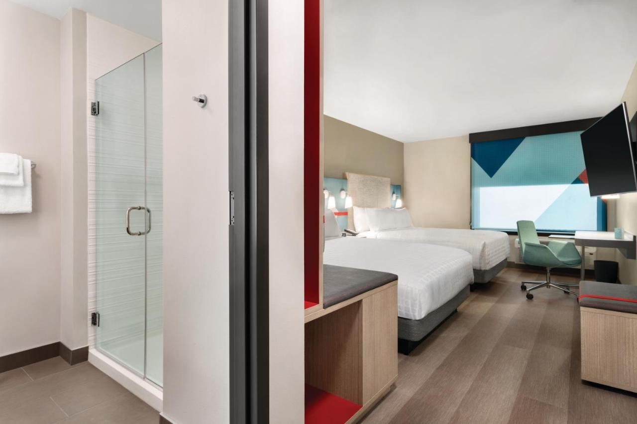 Queen Room with Two Queen Beds Hearing Accessible at avid hotel Cedar Rapids South - Arpt Area by IHG