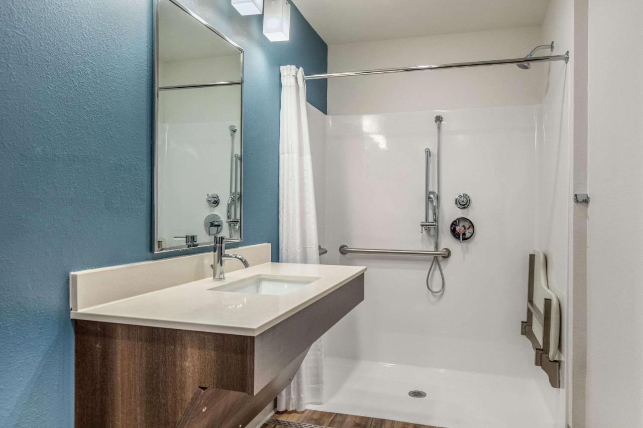 Handicapped Queen Roll-In Shower Non Smoking at WoodSpring Suites Greenville Haywood Mall