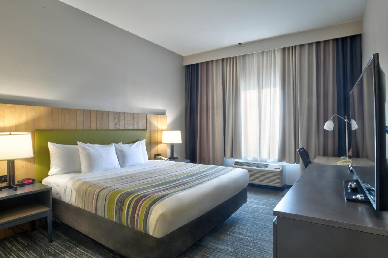 One-Bedroom King Suite with Sofa Bed at Country Inn & Suites by Radisson, Oklahoma City Airport, OK