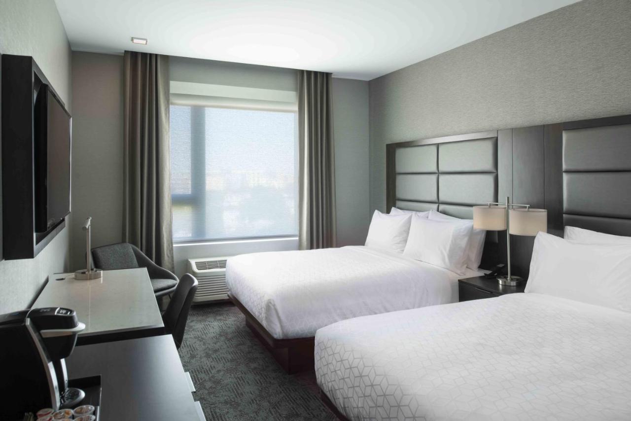 Queen Room with Two Queen Beds - Hearing Accessible - Non-Smoking at Holiday Inn Express Boston Logan Airport - Revere by IHG