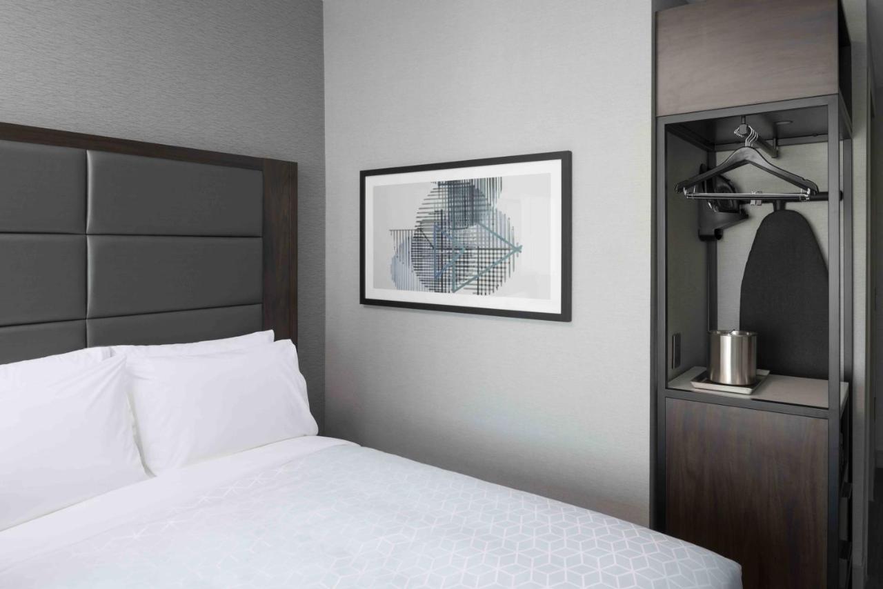 Queen Room with Two Queen Beds - Hearing Accessible - Non-Smoking at Holiday Inn Express Boston Logan Airport - Revere by IHG